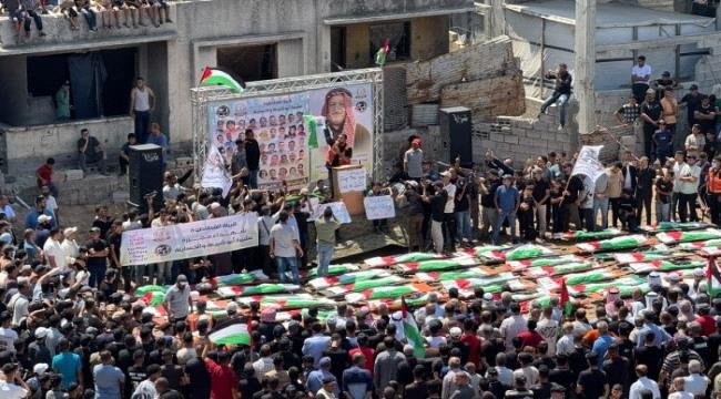 غزة تشيّع 112 شهيدًا من عائلتي الحساينة وأبو شريعة في أكبر جنازة بتاريخ فلسطين غزة تشيّع 112 شهيدًا من عائلتي الحساينة وأبو شريعة في